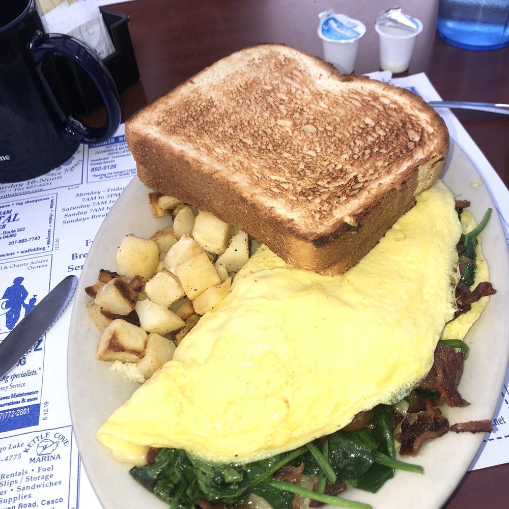 Kelley's Sebago Diner - Omelette with cheddar cheese, spinach, bacon, and avocado. Accompanied by a side of home fries and two slices of toast! - Breakfast & Brunch Near Me - Windham, Maine Kelley's Sebago Diner - Omelette with cheddar cheese, spinach, bacon, and avocado. Accompanied by a side of home fries and two slices of toast! - Breakfast & Brunch Near Me - Windham, Maine