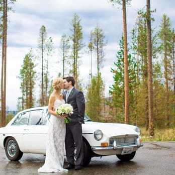 Ashley McKenzie Photography - Bride and Groom with their vintage car at their wedding at Devil's Thumb Ranch in Tabernash, CO. - Event Photography Near Me Ashley McKenzie Photography - Bride and Groom with their vintage car at their wedding at Devil's Thumb Ranch in Tabernash, CO. - Event Photography Near Me