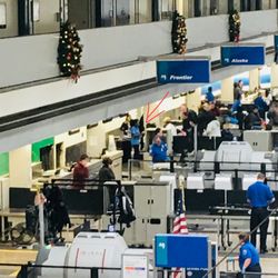 Alaska Airlines - This lady (the one with the arrow pointed) was the rudest worker we ever encountered in SLC. Wanted to smack her right across her face.