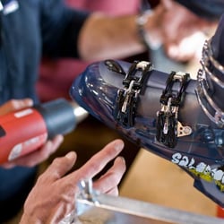 Christy Sports Big Sky Town Center - Grizzly's expert boot fitters punching a ski boot. We make custom foot beds, custom liners and boot modifications.
