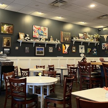 Bones' Burgers - ables and chairs in a restaurant - Burgers Near Me - Montgomery, Ohio Bones' Burgers - ables and chairs in a restaurant - Burgers Near Me - Montgomery, Ohio