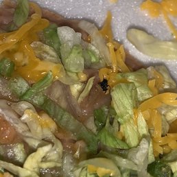 a close up of a salad with lettuce and cheese a close up of a salad with lettuce and cheese