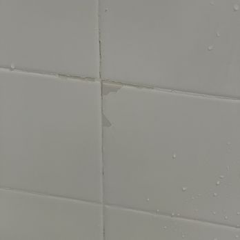 Bath Fitter - Old shower wall tile glaze peeling - General Contractors Near Me - Novi, Michigan