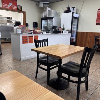 Keating Pizza - a table and chairs in a restaurant - Pizza Near Me - Saanichton, British Columbia