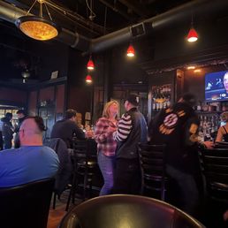 View of the bar with happy patrons. View of the bar with happy patrons.