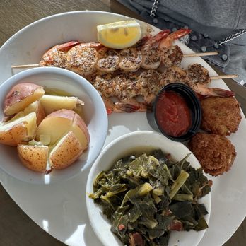 Zachry's Riverhouse - Shrimp with collard greens and red potatoes - Seafood Near Me - Jekyll Island, Georgia Zachry's Riverhouse - Shrimp with collard greens and red potatoes - Seafood Near Me - Jekyll Island, Georgia