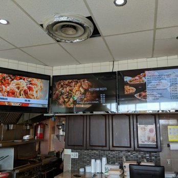 Bavu Villas - New menus layered on triple tvs - Sri Lankan Near Me - Toronto, Ontario