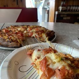 Pizza with banana peppers, tomato, and bell peppers Pizza with banana peppers, tomato, and bell peppers