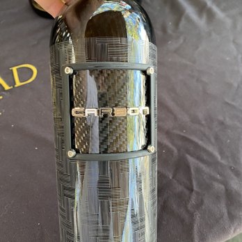 Adobe Road Wines - a person opening a wine bottle - Wine Tasting Room Near Me - Petaluma, California