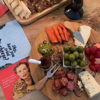 Les Amis Du Fromage - a cheese board with meats and vegetables - Cheese Shops Near Me - Vancouver, British Columbia