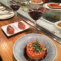 Wine, steak tartar and salmon tartar Wine, steak tartar and salmon tartar