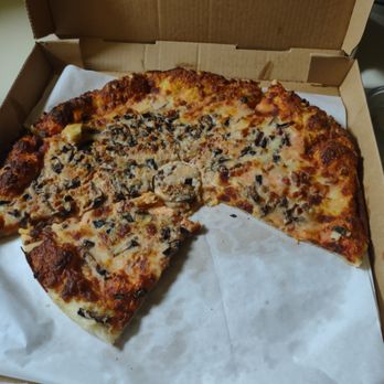 Sandy's Deli & Catering - a half eaten pizza - Delis Near Me - Rouses Point, New York