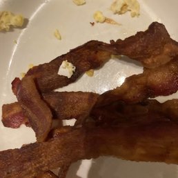Burnt bacon and egg shells. Burnt bacon and egg shells.