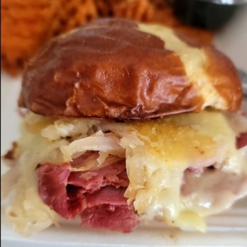 Father Tom's Pub - The Neuben Grilled corn beef smothered w/ sauerkraut, grilled onions, swiss cheese, On toasted pretzel bun w/ housemade stout mustard. - Bars Near Me - Cookeville, Tennessee Father Tom's Pub - The Neuben Grilled corn beef smothered w/ sauerkraut, grilled onions, swiss cheese, On toasted pretzel bun w/ housemade stout mustard. - Bars Near Me - Cookeville, Tennessee