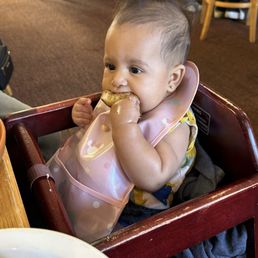 Baby girl enjoying French Toast Baby girl enjoying French Toast
