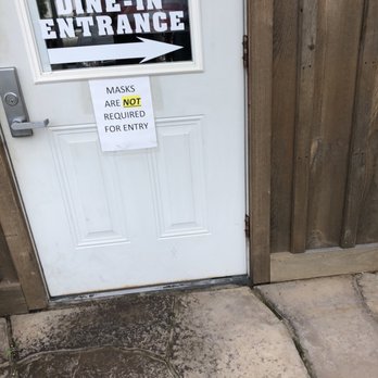 Stampede Barbecue - the back door with a sign that reads "MASKS ARE NOT REQUIRED FOR ENTRY" - Barbeque Near Me - Mohnton, Pennsylvania Stampede Barbecue - the back door with a sign that reads "MASKS ARE NOT REQUIRED FOR ENTRY" - Barbeque Near Me - Mohnton, Pennsylvania