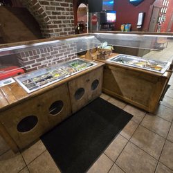 Fully stocked salad bar for nobody in the restaurant.