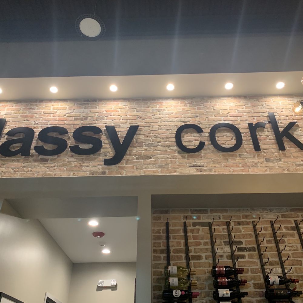 Lovely interiors with a large wine selection on the interior wall.
