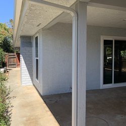 Rainworks Seamless Rain Gutters - Patio with new downspout