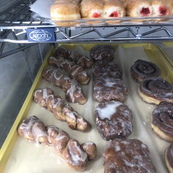 Pantry Shelf - Double cinnamon twists, apple fritters, glazed cinnamon rolls and above raspberry filled glazed donut holes!! Something special everyday!! - Convenience Stores Near Me - Hazard, Kentucky