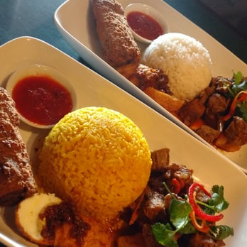 Tropika Malaysian Cuisine - Two lunch combo C. One with steamed rice and the other with yellow ginger rice ($1 extra) - Malaysian Near Me - Edmonton, Alberta Tropika Malaysian Cuisine - Two lunch combo C. One with steamed rice and the other with yellow ginger rice ($1 extra) - Malaysian Near Me - Edmonton, Alberta