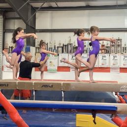 Jim coaching the level 2 on beam. Jim coaching the level 2 on beam.