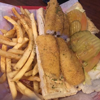 Copper Monkey Grill - Fried Catfish Poboy with fries. - Dive Bars Near Me - New Orleans, Louisiana