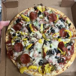 Levee Commissary - Supreme Pizza loaded with your favorite meats and veggie!