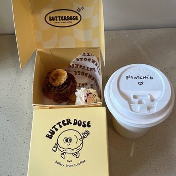 Butter Dose - Chocolate Banana cream puff, Sesame Goma cream puff, and a oat milk pistachio latte - Bakeries Near Me - New York, New York Butter Dose - Chocolate Banana cream puff, Sesame Goma cream puff, and a oat milk pistachio latte - Bakeries Near Me - New York, New York