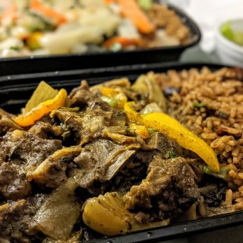 Simone's Caribbean Restaurant - Curry Goat with rice and beans. - Caribbean Near Me - Toronto, Ontario Simone's Caribbean Restaurant - Curry Goat with rice and beans. - Caribbean Near Me - Toronto, Ontario