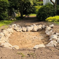Knight's Grading & Excavating - Newly built, rock lined, rain garden.