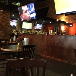 Wing Daddy’s - Looking towards the main bar; top shelf liquor. Approximately 20 large screen TV’s. Clean and crisp atmosphere!