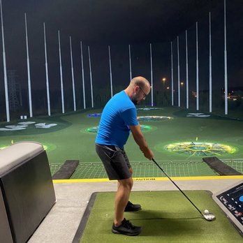 Topgolf - My friend Brian, who is about to whiff the ball - New American Near Me - Jacksonville, Florida Topgolf - My friend Brian, who is about to whiff the ball - New American Near Me - Jacksonville, Florida