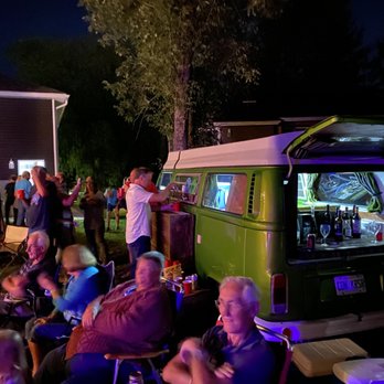 Pop Top Pub - a group of people sitting in lawn chairs - Beer Bar Near Me Pop Top Pub - a group of people sitting in lawn chairs - Beer Bar Near Me