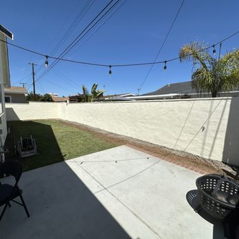 Delgados Landscape - Refinished wall, painted to match the house. - Landscaping Near Me Delgados Landscape - Refinished wall, painted to match the house. - Landscaping Near Me