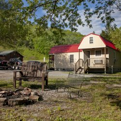 Bramwell Adventures LLC - View of the cabins from the firepit, next to the Bluestone River.