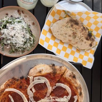 Astra - Arugula salad, Italian olive sandwich, pepperoni fennel pizza - Cocktail Bars Near Me - Buda, Texas