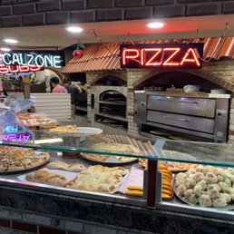 Pizza ovens behind the serving counter.