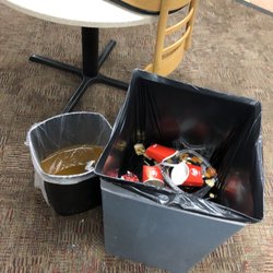 Wendy's - Trash cans in the dining area with lots of water from leaks in the ceiling. How long have they been here harboring bacteria?