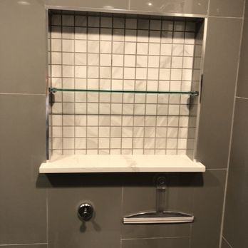 HSH Remodeling - a shower with a shelf above the toilet - General Contractors Near Me