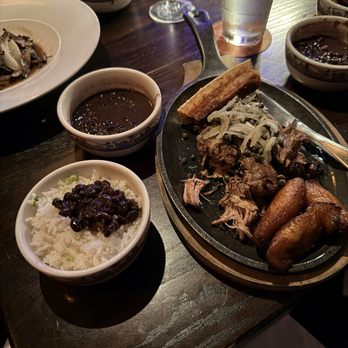 Cuba Libre Restaurant & Rum Bar - Lechon Asado with white rice and black beans - Cuban Near Me - Orlando, Florida