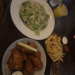 Wings, Caesar salad and fries Wings, Caesar salad and fries