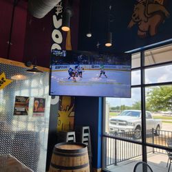 Rio’s Brewing - Large tv playing hockey