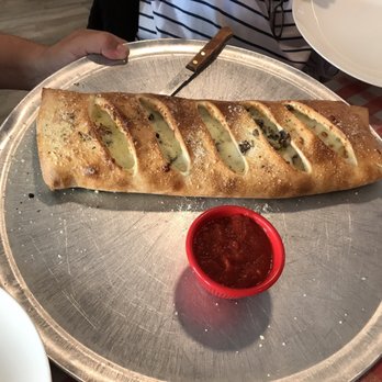 Little Anthony's Pizza - a long loaf of bread on a tray - Pizza Near Me - Clermont, Florida Little Anthony's Pizza - a long loaf of bread on a tray - Pizza Near Me - Clermont, Florida