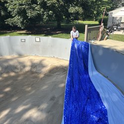 Oasis Pool and Spas - Above ground liner being installed