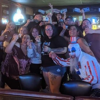 Outpost Bar - a group of people holding up beer glasses - Bars Near Me - Ely, Nevada