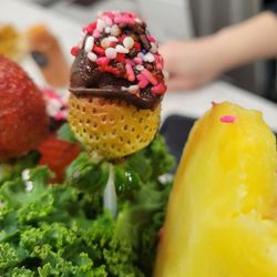 Edible Arrangements - Look at this yellow strawberry! It literally looks like a 5 year old dipped it in chocolate. So disappointing.