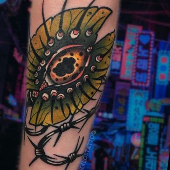Revolution Ink - Monster Plant with Barbed Wire by Shane Klos - Piercing Near Me - Evansville, Indiana