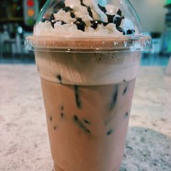 CrossRoads Coffee House - A café mocha over ice with whipped cream and chocolate drizzle