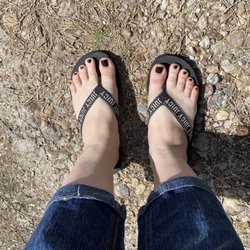 My toes painted with black gel polish.